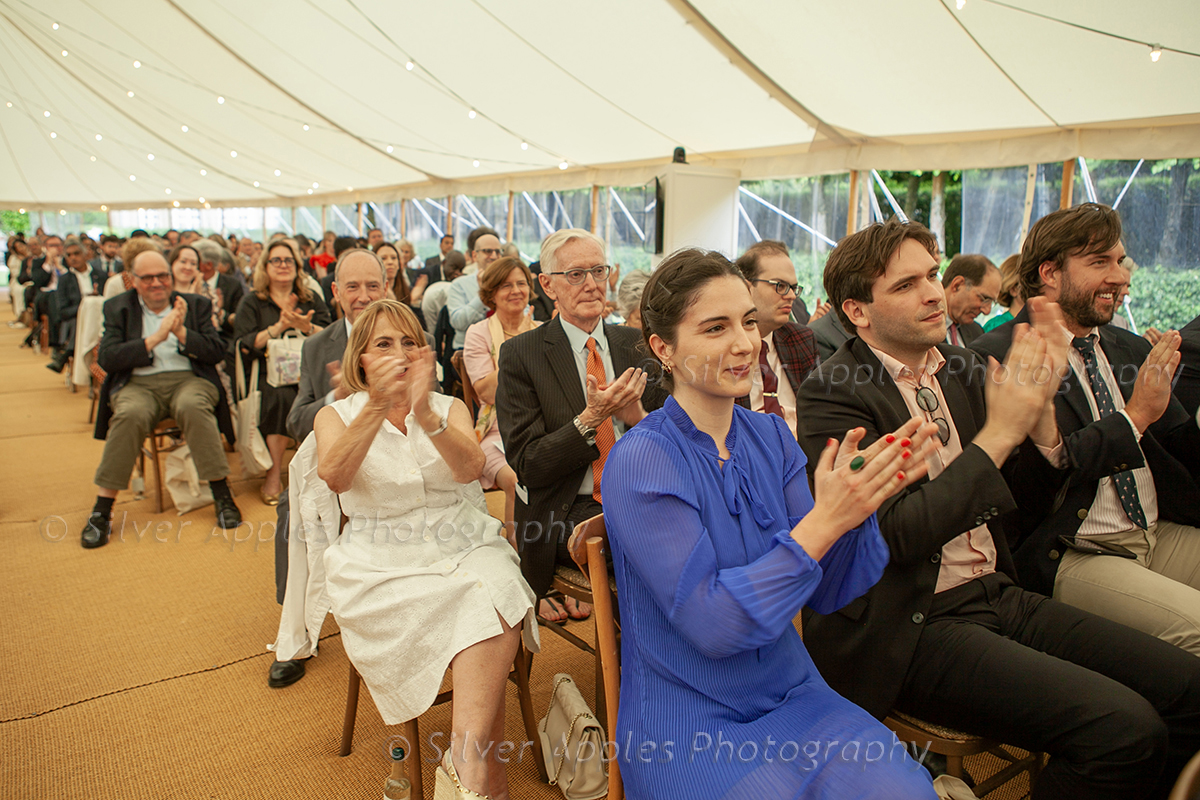 Conference delegates applauding the speaker